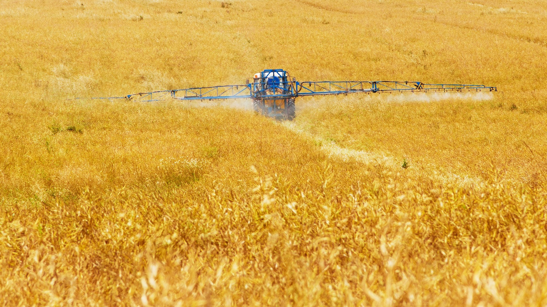 Tractor spraying pesticides