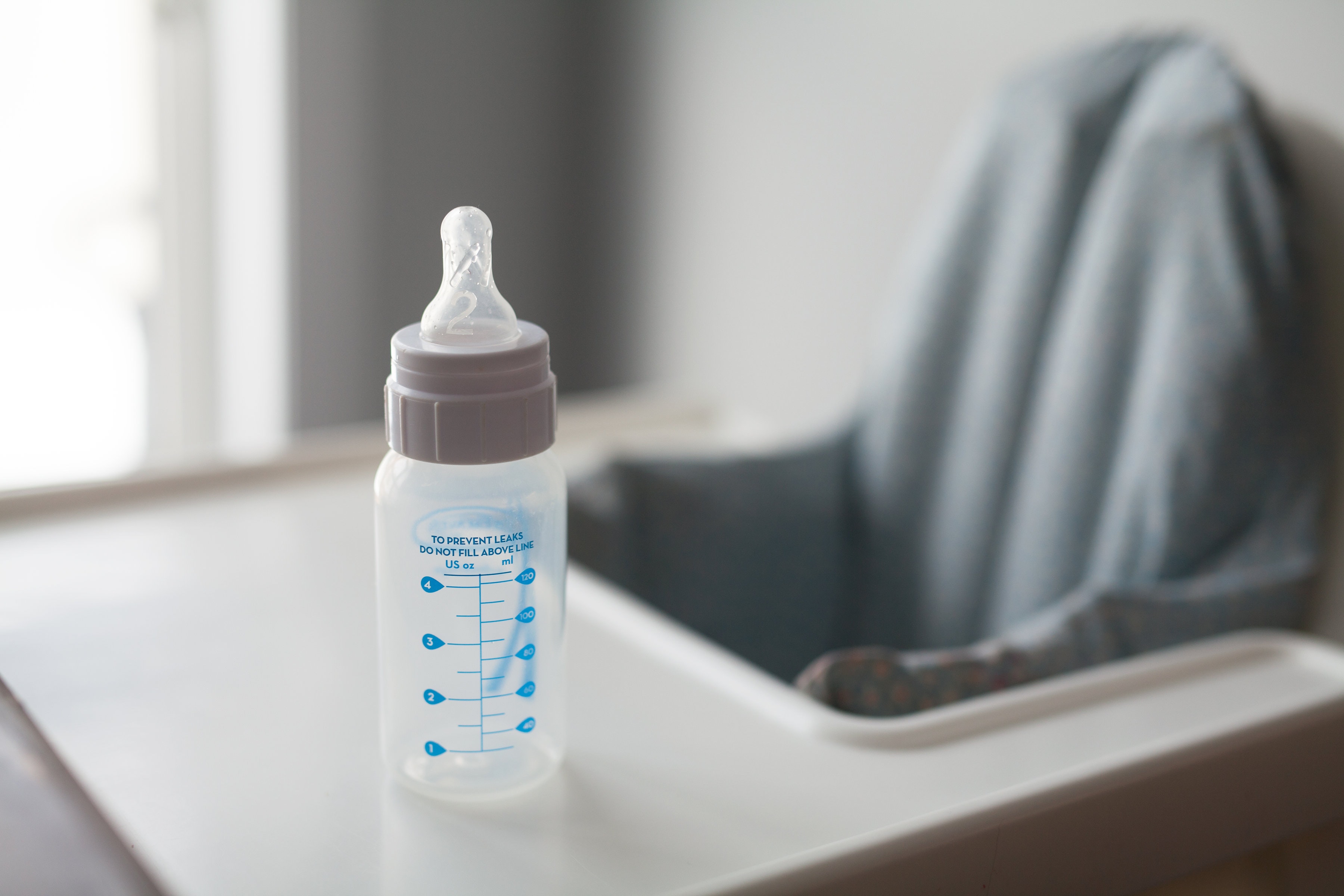 Baby bottle on high chair