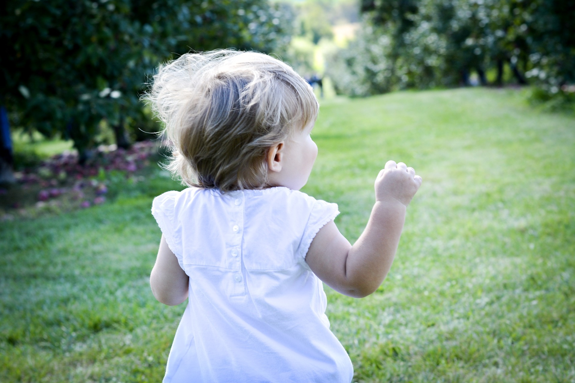 Little girl running away outdoors