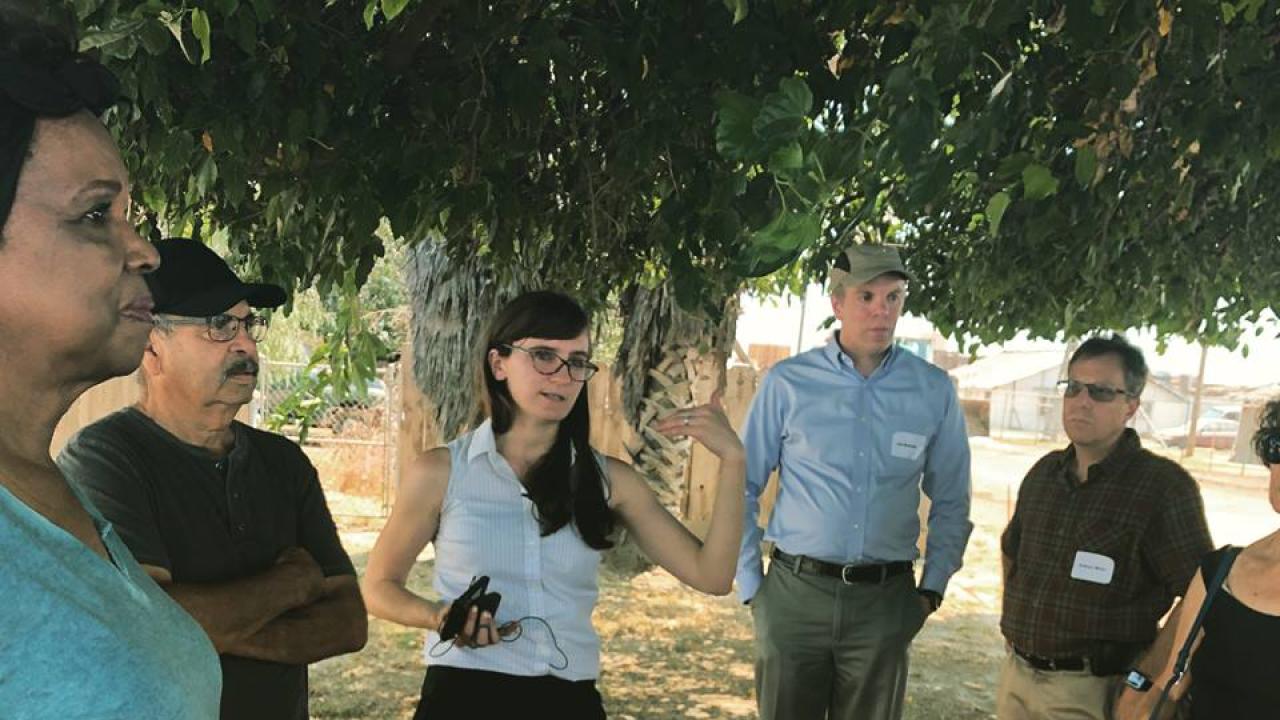 Community activists talking to UC Davis scientists and representatives from the National Institute of Environmental Health Sciences about some of the problems that come with industrial development. Environmental Justice Tour, Fresno, CA, July 2018. Community members with scientists