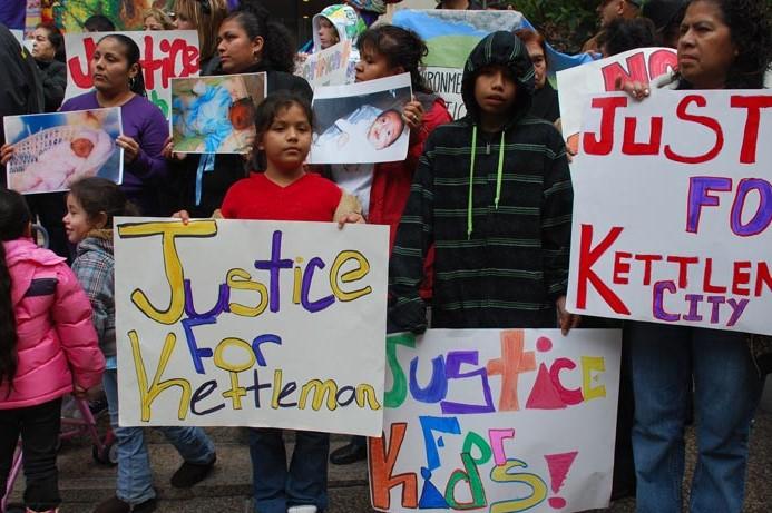 Parents and their children protesting in Kettleman City, California.