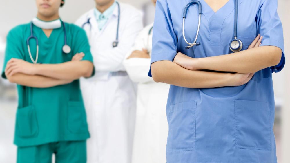 Healthcare workers standing with arms crossed