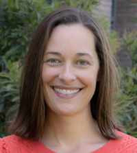 Headshot of Meghan Miller, Ph.D., smiling outdoors.