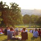 Group of people sitting in a park