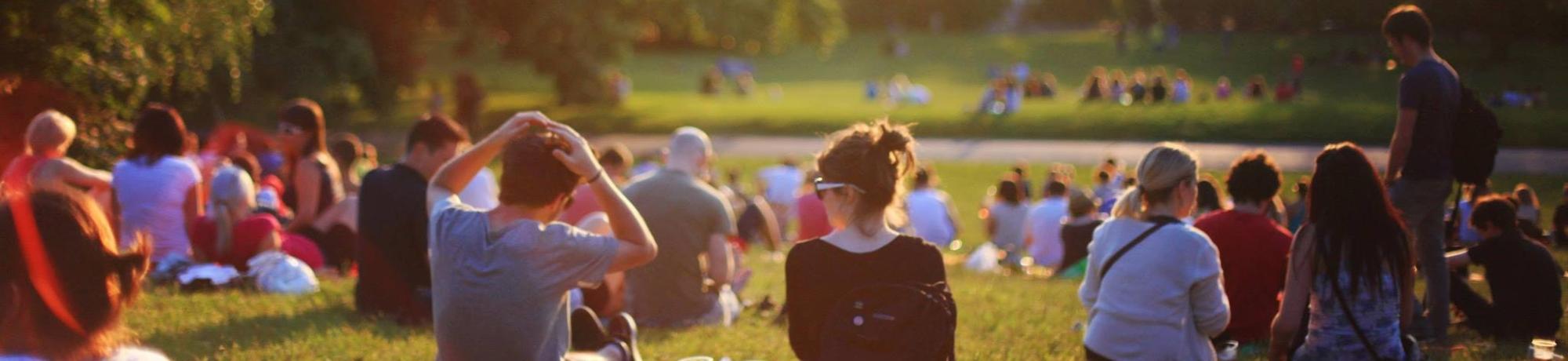 Group of people sitting in a park