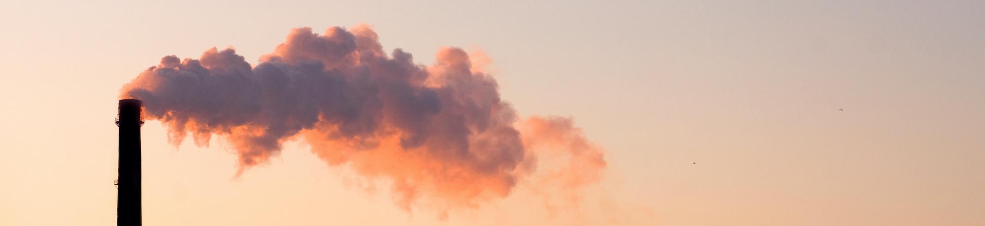 smoke coming out of an industrial chimney 